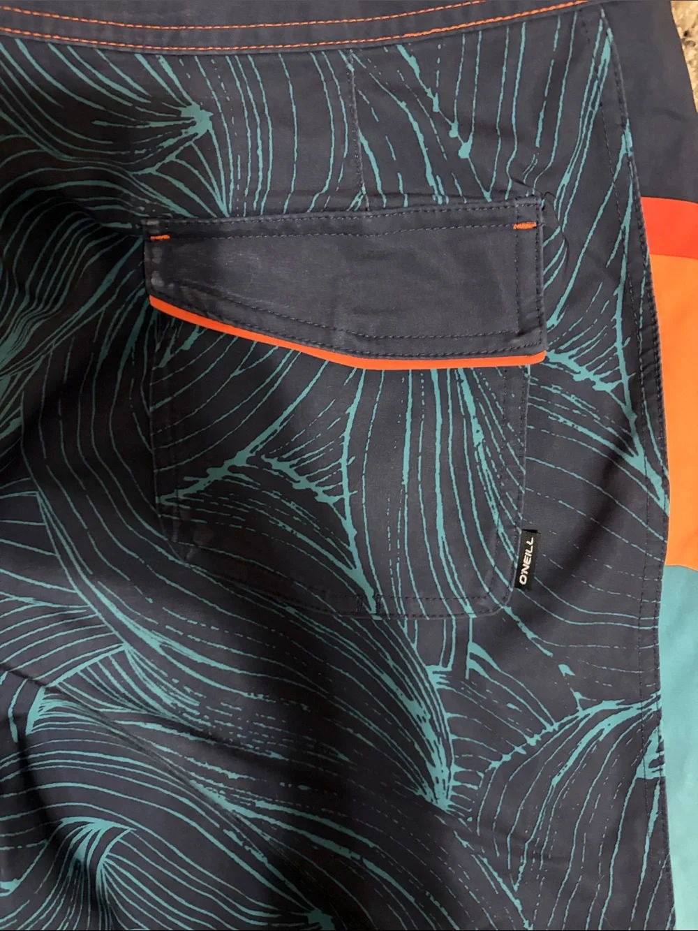 O'Neill Navy Swim Board Shorts with Teal Wave Print and Orange Accents